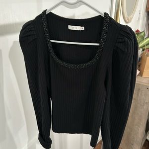 Unique piece. Long sleeve puffed shoulder shirt. With rhinestone neckline.